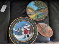 All three Betty Lou Simpson plaques on sofa