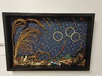 Front view of mixed media artwork in frame