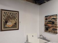 Both art pieces on wall giving overall view