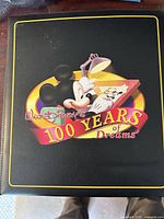 Front of binder with 100 Years of Dreams graphic