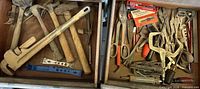 Open drawers showing full assortment of hammers, pipe wrench, pliers, screwdrivers, clamps, scissors, hex keys, extractors and blades