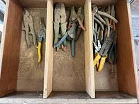 drawer section with multiple pliers, snips and wire cutters