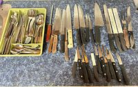 Full lot overview with flatware tray and knives laid out
