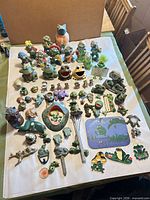 Overview of entire frog collection laid out on table