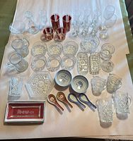 All items laid out showing quantity and variety of glassware and porcelain pieces