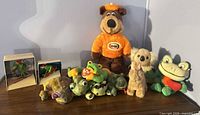 Group shot of all plush toys and boxed figurines on display