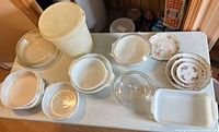 Group shot of all dinnerware, bakeware and plastic tub