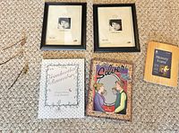 Group shot of all items: two 8x10 frames, 4x6 frame, two books, three bookmarks