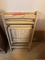 Chairs folded and stacked showing overall look and finish