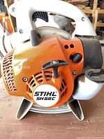 Close-up showing Stihl SH 56 C model badge and engine housing