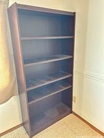 Front view of entire bookcase, shelves visible