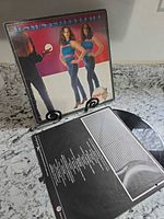 Front cover and vinyl partially in inner sleeve