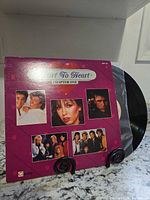 Front cover and record partially removed