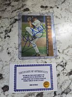 Front of signed Jack McDowell card in holder