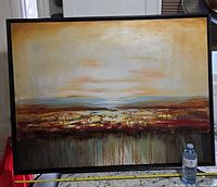 Front view of framed canvas painting