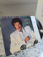 Front jacket of Lionel Richie Dancing on the Ceiling LP on stand
