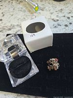 Ring, box and sleeve overall view