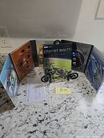 Fold-out digipak open displaying all Planet Earth DVDs and case