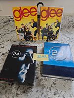 Front view of all DVD sets upright on counter