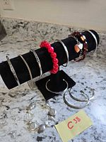 All jewelry pieces on display rod and countertop