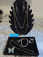 Group shot showing all jewelry pieces on display stand and tray