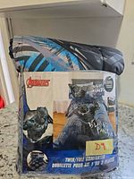 Front of sealed package showing Black Panther design and branding