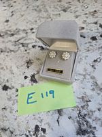 Earrings in open grey velour box labeled 14kt gold next to lot tag