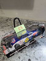 Boxed 1:24 die-cast car showing overall packaging