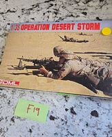 Front of sealed box showing prone soldier and kit branding