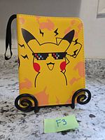 Front view of yellow Pikachu binder standing upright