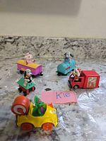 Five die-cast vehicles grouped on countertop