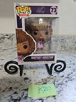 Front view of sealed Whitney Houston Funko Pop Icons #73 figure box