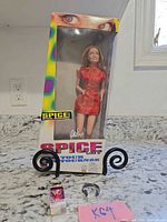 Full view of Ginger Spice doll in original box on counter