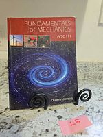 Front cover showing title, course code, university, artwork