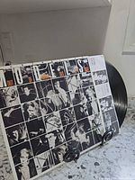 Front sleeve and record displayed on stand