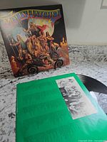 Front album cover and inner sleeve with vinyl partially visible