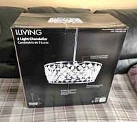 Front of retail box showing chandelier image and specifications