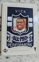 Front of 2003 Upper Deck Michael Vick patch card showing embroidered patch and portrait