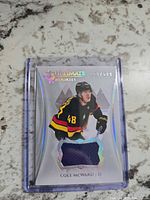 Front view of Cole McWard Ultimate Rookies jersey card showing player image, jersey swatch, serial number