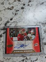 Front view of Justin Williams autographed Power Marks card in sleeve