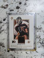 Front of Roman Cechmanek jersey card showing photo, swatch, serial number