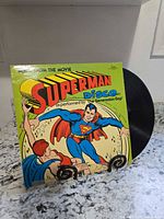 Front cover showing Superman artwork and record partially visible