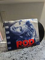 Front sleeve portrait of Rod Stewart with vinyl partially visible