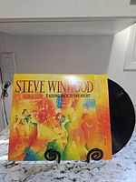 Front cover of Steve Winwood Talking Back to the Night LP displayed with record partially visible