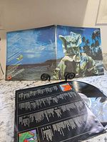 Front gatefold artwork displayed with record and inner sleeve