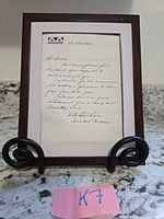 Framed handwritten letter with signature, front view