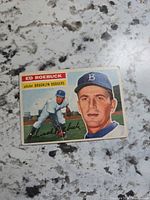 Front of 1956 Topps Ed Roebuck card showing portrait and action image