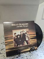 Front album cover with record partially visible