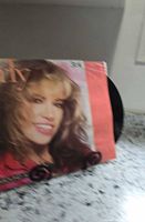 Front cover head-shot portrait of Carly Simon on record jacket