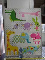 Front view showing full animal design and scale with water bottle